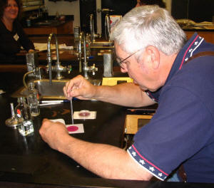 Bill Camp learns to test water quality using a Petrifilm test