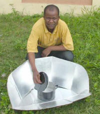 Rashid Adesiyan pasteurizes water in a solar CooKit in Ago-Are