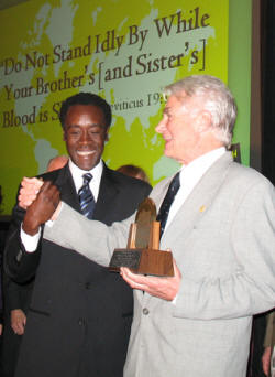 Derk Rijks (right) is congratulated by Don Cheadle.