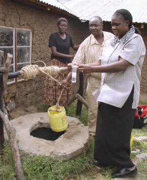 Margaret (right) conducts water quality tests in Nyakach, Kenya