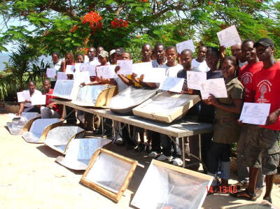 Maputo youth show off their solar cookers and the certificates they earned for completing the training course