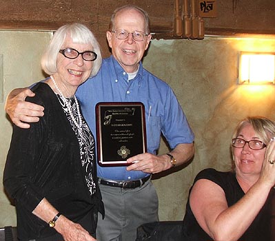 Barbara Knudson (left) receives award from SCI founder and board member Dr. Bob Metcalf
