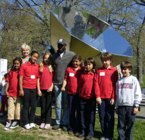 Rowena Gerber (back row, left) and her students pose with the large Villager Sun Oven