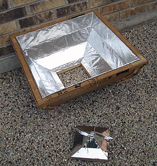 Goodman's solar cooker can be built in two pieces: a weighted middle section that holds the HotPot and the four-sided reflector that surrounds it